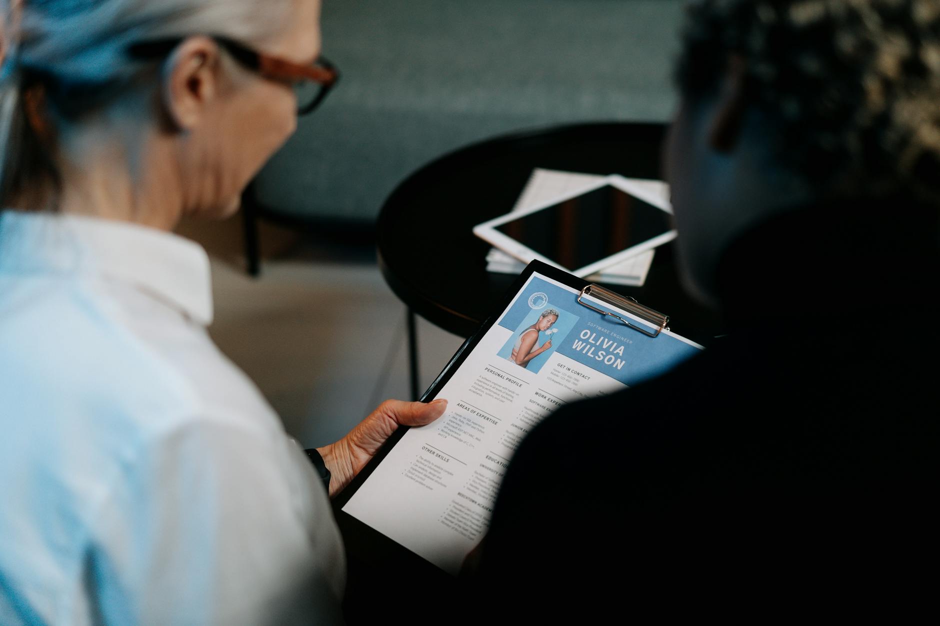 pexels photo 5989941 woman holding a clipboard with resume